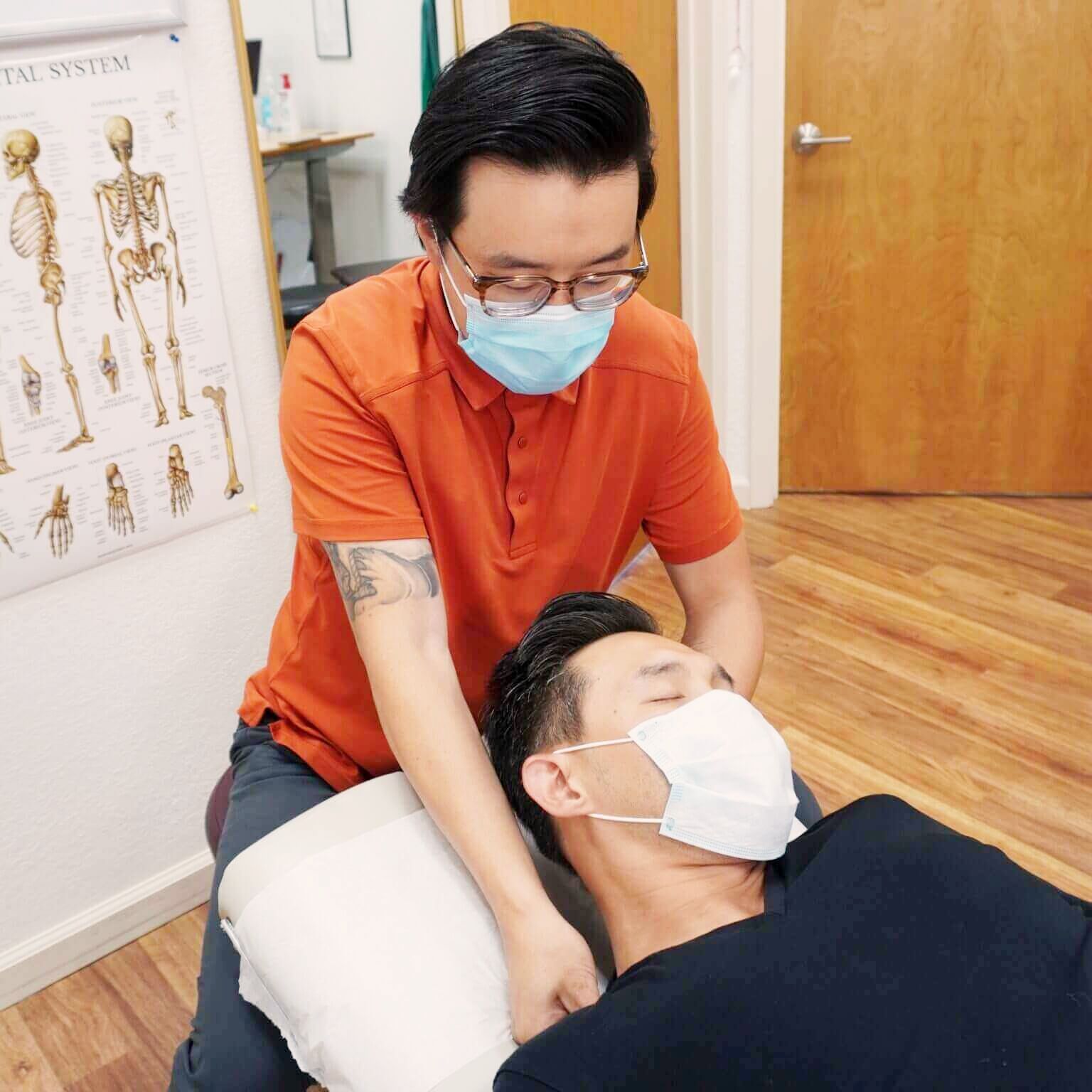 Dr. Wang treating a patient