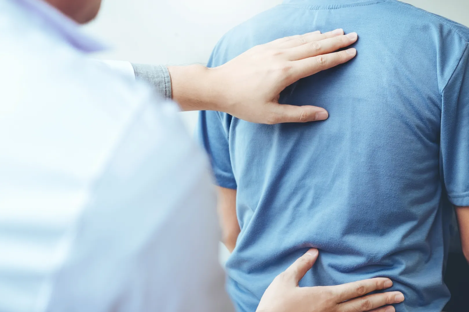 Chiropractor massaging back of a patient